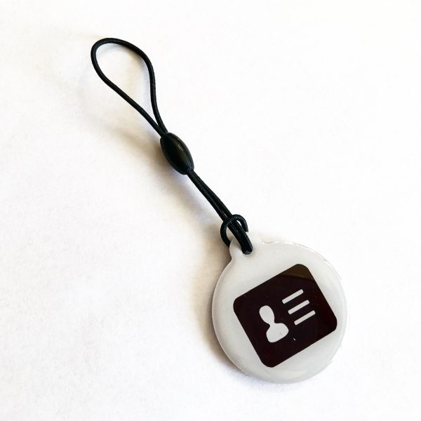 White epoxy NFC hang tag with a vCard logo